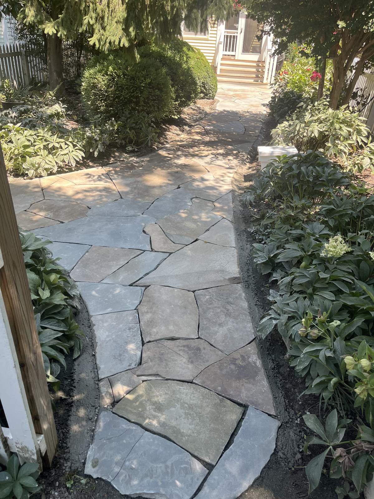 Flagstone garden walkway installed by Top Notch Property Services