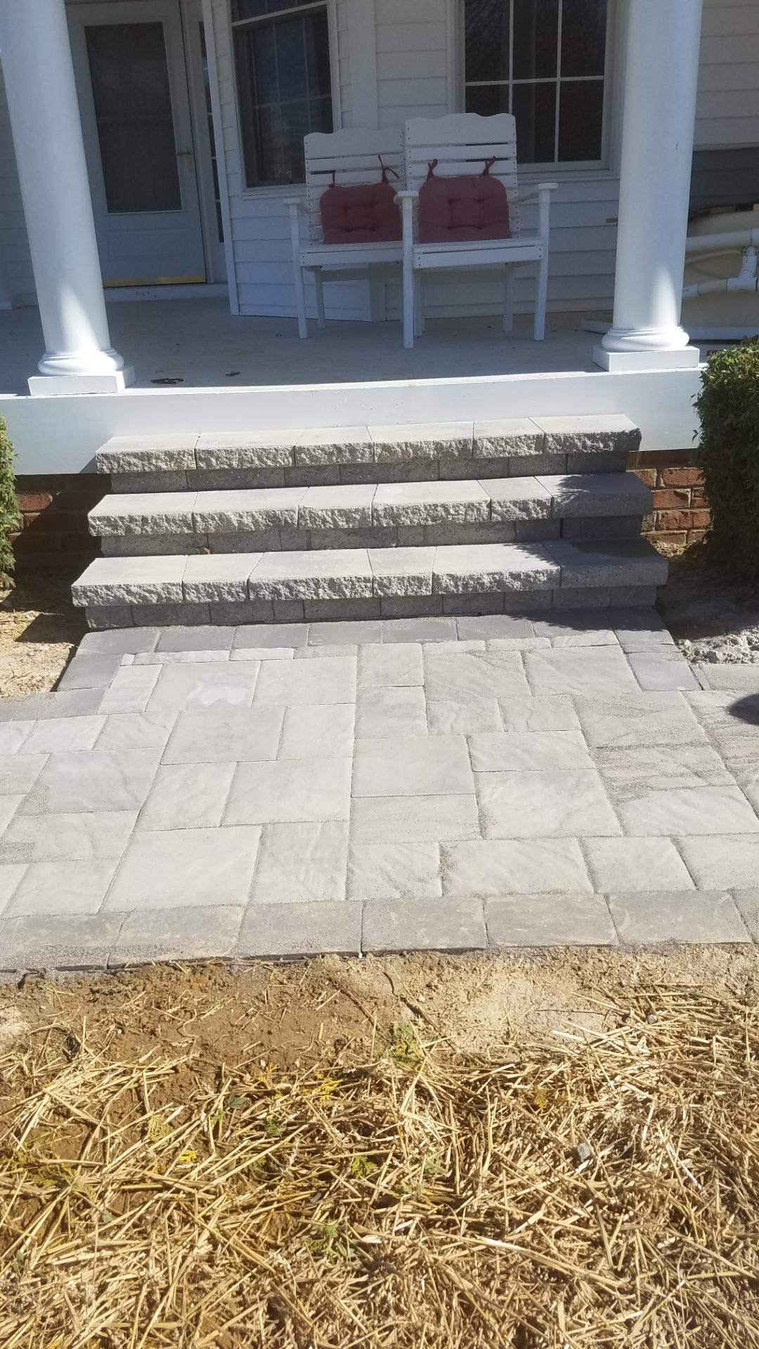 Completed paver steps and patio installed by Top Notch Property Services
