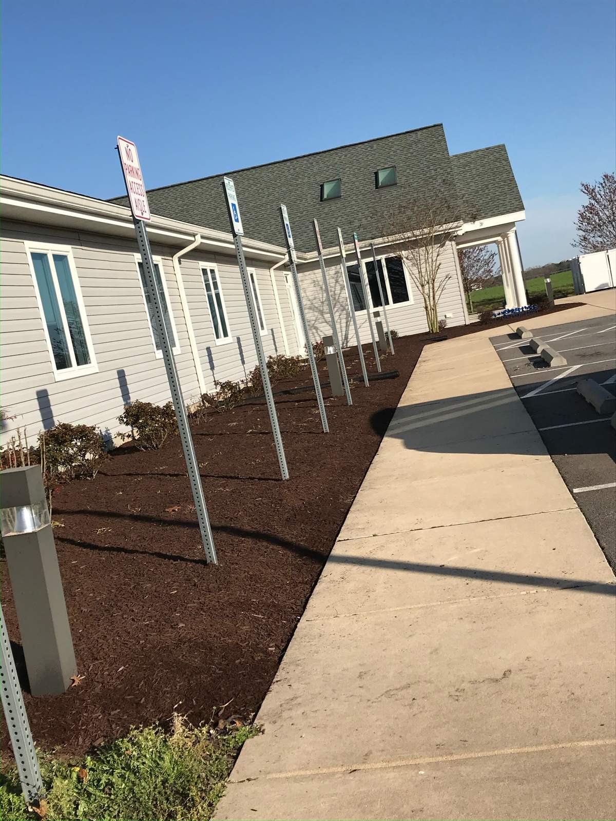 Fresh mulch bed installation by Top Notch Property Services